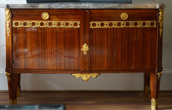 A Louis XVI style ormolu mounted, marble topped, walnut commode, 133cm wide x 88cm high.