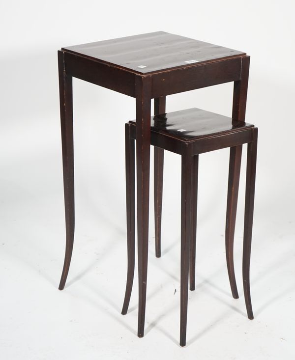 The Barbara Barry Collection by Baker; a modern nest of two mahogany occasional tables on tapering supports, the largest 37cm wide x 73cm high.