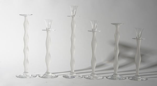 A set of four Orrefors clear and frosted glass candlesticks and two matching candle stands, etched marks, the tallest 41cm high, (6).