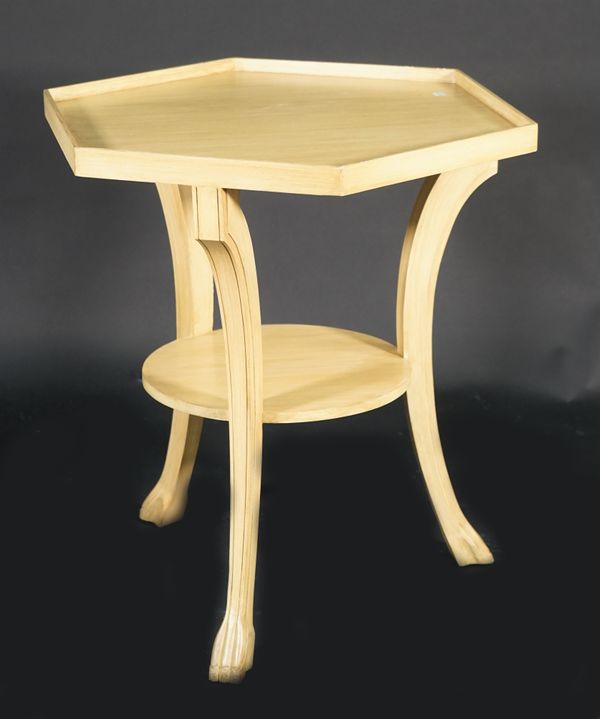 A modern cream painted two tier octagonal occasional table, on outswept claw supports, 73cm wide x 72cm high.