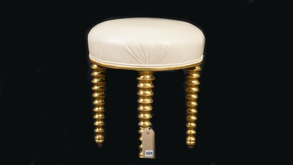 A modern giltwood circular footstool, on heavy bobbin turned supports, with faux white leather upholstery, 43cm diameter x 46cm high.