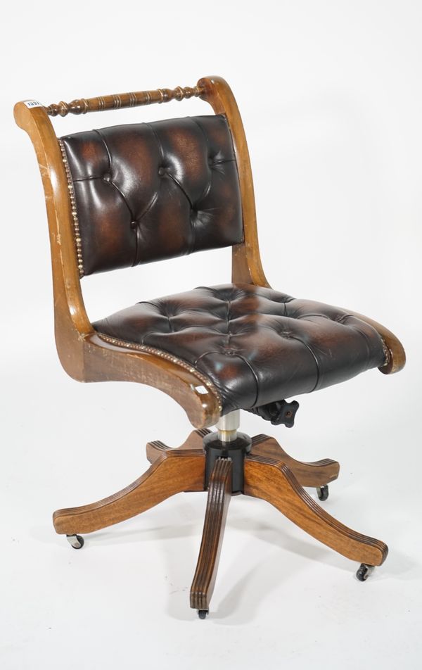 A modern stained beech office chair, with faux leather button back upholstery, 48cm wide x 87cm high.