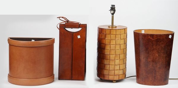 Modern leather comprising; a cylindrical table lamp, 32.5cm high, a Thomas Goode waste bin, another similar of oval form and a carrying bag, (4).