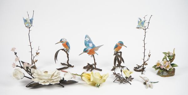 A Boehm porcelain mounted metal floral arrangement, 29cm wide, three Albany Worcester porcelain models of kingfishers on metal branch stands, 16cm hig