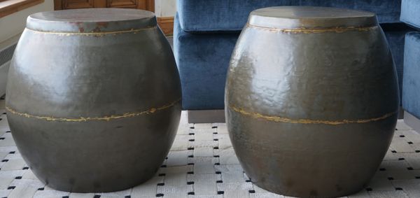 A pair of parcel gilt patinated metal barrel seats, 38cm wide x 45cm high, (2).