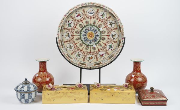 A modern pottery circular dish decorated with wild birds and butterflies on a metal stand, 47cm diameter, a pair of modern red ground porcelain vases,