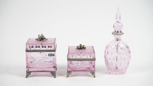 Baldi, Italy; a pink glass and silver plated box and hinged cover with engraved decoration, 16cm high, another smaller and a pink glass scent bottle a