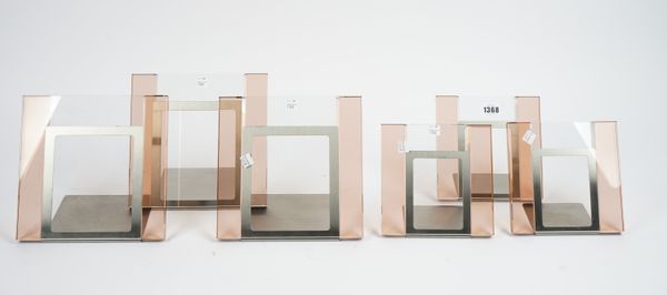 A set of six coloured glass and brushed steel photograph frames, each of contemporary square form of two differing sizes, the largest 22.5cm high, (6)