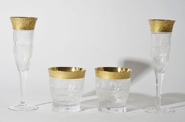 A group of Moser gilt decorated glasses comprising eleven tumblers and eleven fluted glasses, (22).