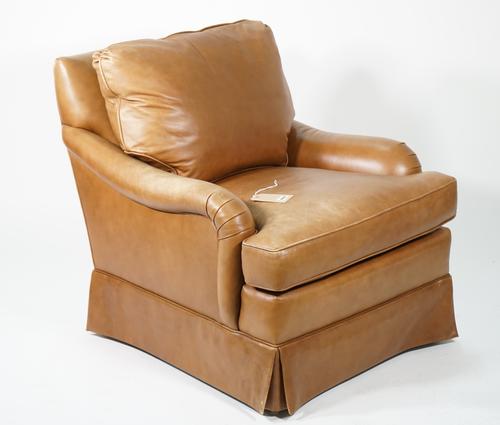 Edward Ferrel; a modern Howard style leather upholstered low armchair, 80cm wide x 80cm.