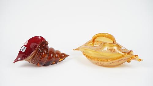 A Murano glass nautilus shell, etched mark 'Belle Case Roue Murano', 33cm, and a similar gilt orange glass shell form bowl, unsigned, 41cm wide, (2).