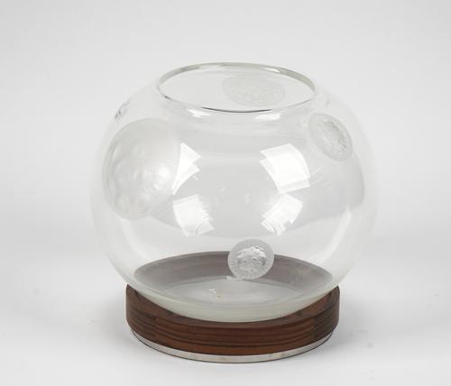 A Steuben glass bowl by Michelle Ola Doiur, Ltd Edition, the globular form engraved with spore type symbols, engraved to the base, on a hardwood stand