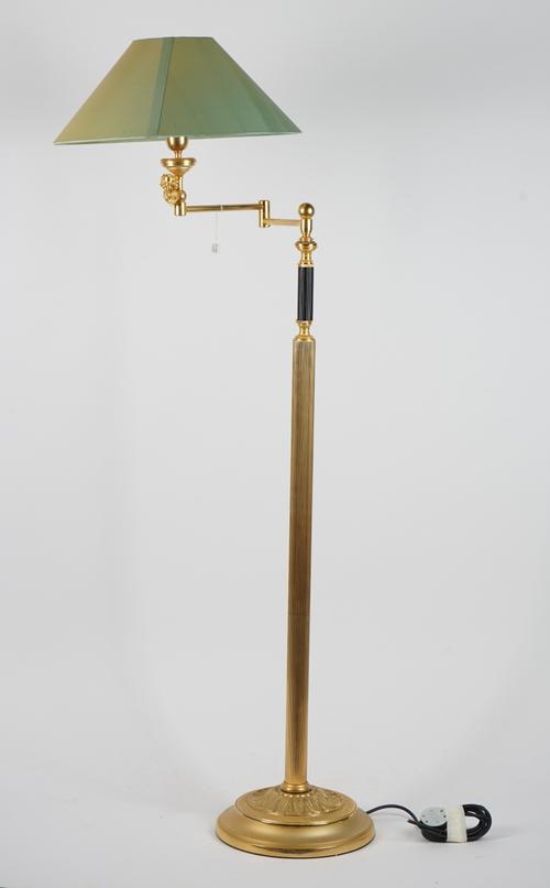 An Italian gilt metal standard lamp with adjustable arm over a fluted column and circular acanthus leaf cast base, 120cm high.