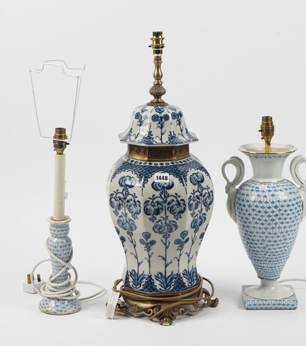 A Herend style blue and white baluster lamp, 36cm high, a similarly decorated smaller lamp and a gilt metal mounted blue and white lamp, (3).