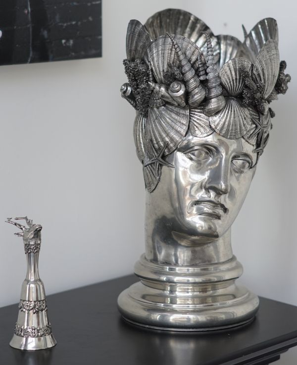 A white metal bust modelled as a wine cooler decorated with shells, 50cm high, a silver plated and glass claret jug, a two tier cake stand, a pair of