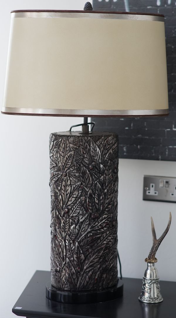 A silvered carved wood lamp, 80cm high, with a shade.