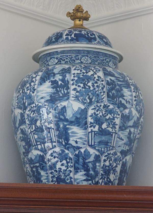 A pair of Chinese blue and white baluster vases and covers with gilt finial, modern, each 55cm high, (2).