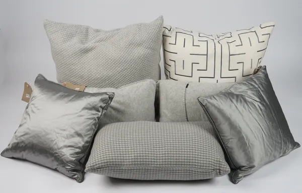 An assortment of grey/ silver cushions, varying materials and patterns, (9).