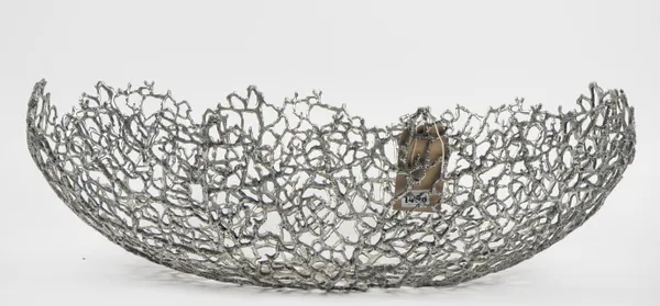 A large white metal oval centre bowl, of pierced naturalistic form, 71cm wide x 22cm high.