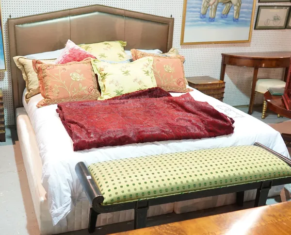 A modern kingsize bed with faux metallic green studded upholstered headboard, 201cm wide x 143cm high, (to include divan base and mattress).