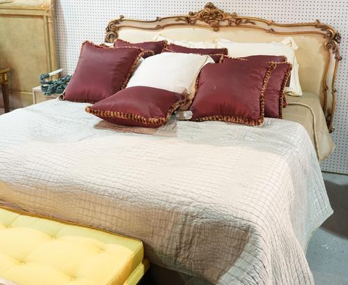 A Victorian style white painted and parcel gilt decorated kingsize bed with divan base and mattress, 200cm wide x 131cm high.