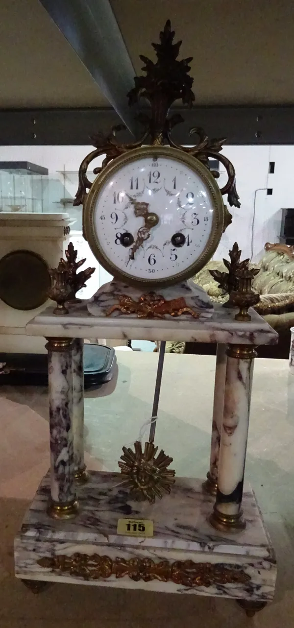 A French gilt metal mounted marble Portico mantel clock, late 19th /early 20th century, the drum case with foliate painted enamel dial over four cylin