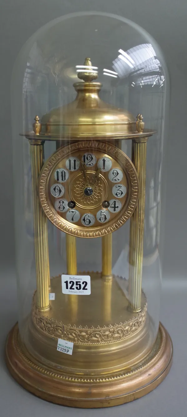 A French gilt metal mantel clock, mid-20th century, the dial and movement housed under a domed and pillared cylindrical arbour on a stepped base, unde