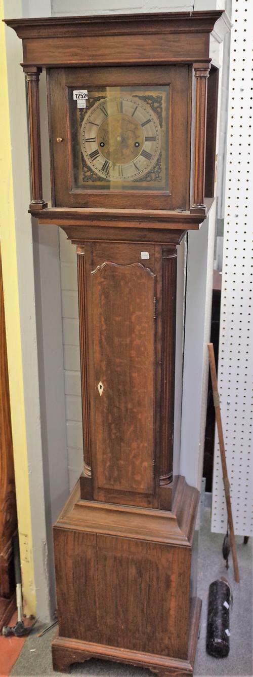 An 8 day longcase clock with 8 inch square brass engraved  dial and a waisted oak case, 170cm high, (cast iron weight & pendulum).