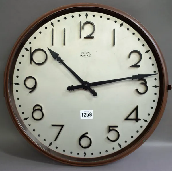 An Art Deco style electric 'Synclock' wall clock by Everett Edgcumbe London, (a.f.), 41cm diameter.