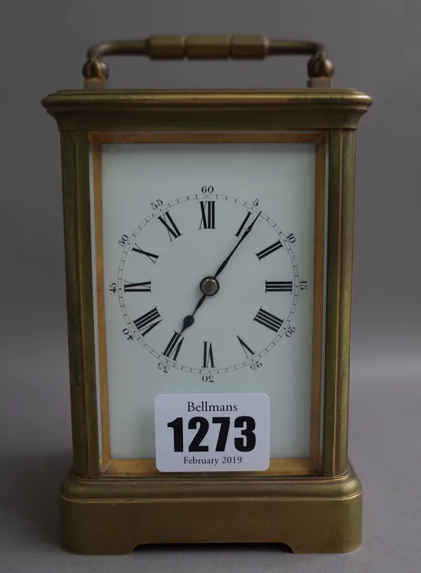 A French brass cased carriage clock, late 19th century, with visible platform escapement, single train movement and enamel dial, 12cm high, (key).