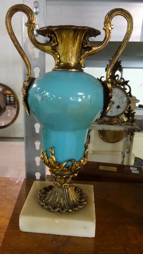 A pair of Victorian gilt metal mounted porcelain garnitures, each of two handled urn form, turquoise body, over a marble plinth, 31cm high, (2).