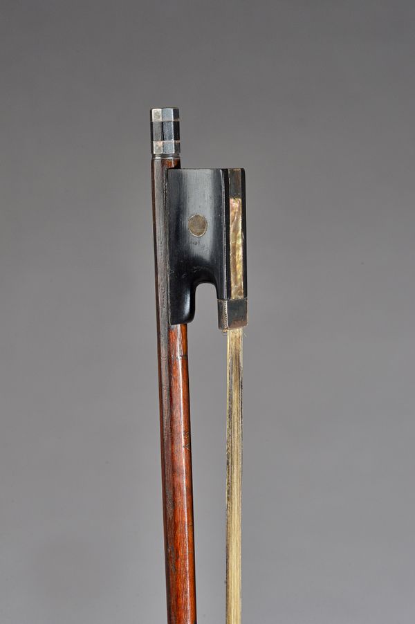 A Violin bow with silver mounts and ivory inlay to the head, indistinctly stamped, possibly 'W.E Hill . . . . .' 74.5cm, 61.4grams.  Illustrated