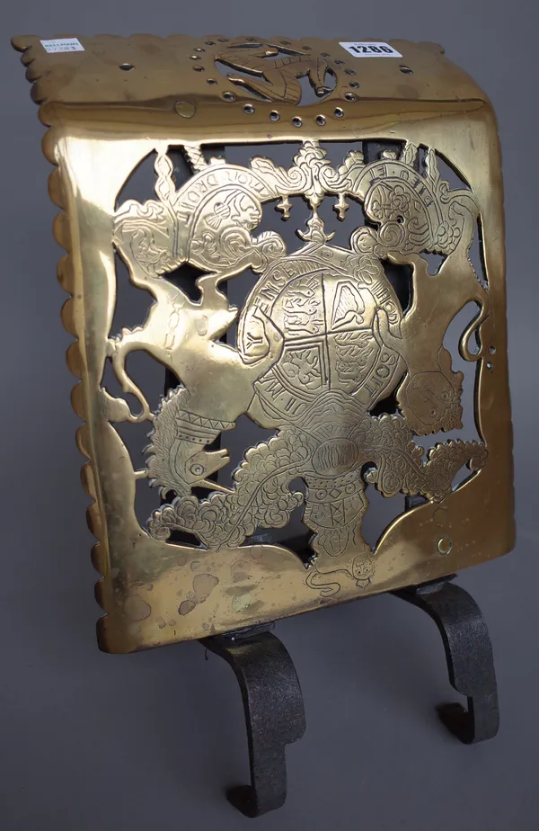 A pierced brass coach step, 19th century, with pierced British standard engraved decoration over The Isle of Man Triskelion, 24.5cm wide.
