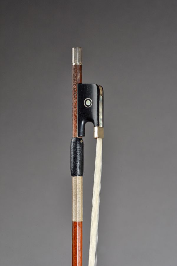 A French violin bow with silver mounts, indistinctly stamped, possibly 'E. Marie Fils', 74.5cm, 61grams.  Illustrated