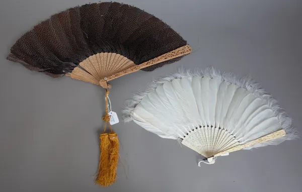 A Cantonese feather and carved ivory fan, circa. 1880 (24cm) and a Cantonese feather and carved boxwood fan (29.5cm) (2).