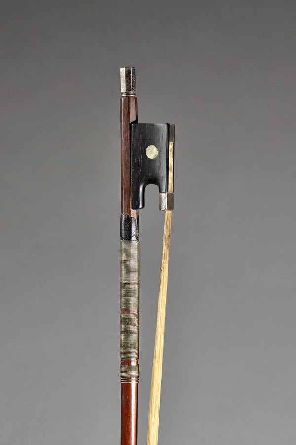 A French violin bow with silver mounts, stamped 'T Lejeune', 74.5cm, 59.9 gras.   Illustrated