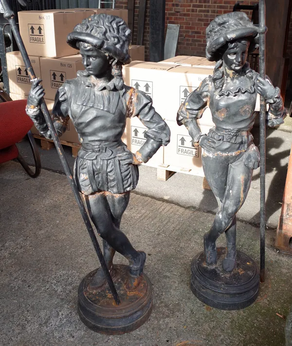 After Edouard Charles Marie Houssin, a pair of mid/late 20th century composite cast iron models of Florentine pages, each modelled holding a Halbard,