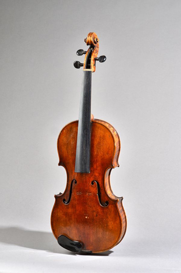 A violin with interior paper label detailed 'Nicolaus Amatus Cremonen Hieronymi', back measures 14.1/8 inches, with two bows and case.  Illustrated