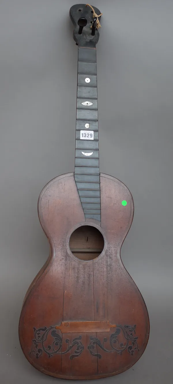 A Continental guitar, lacking interior label, with mother-of- pearl inlay to the ebonised fret board, back measures 17 3/8 inches, (a.f.).