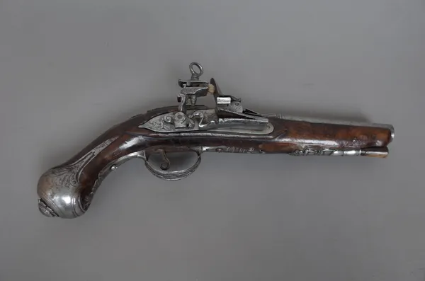 A Continental fintlock pistol, late 18th century, with 16cm circular steel barrel and engraved steel hardware, 29cm overall.