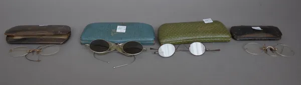 Eight pairs of early 20th century gilt framed spectacles, cased, (8).