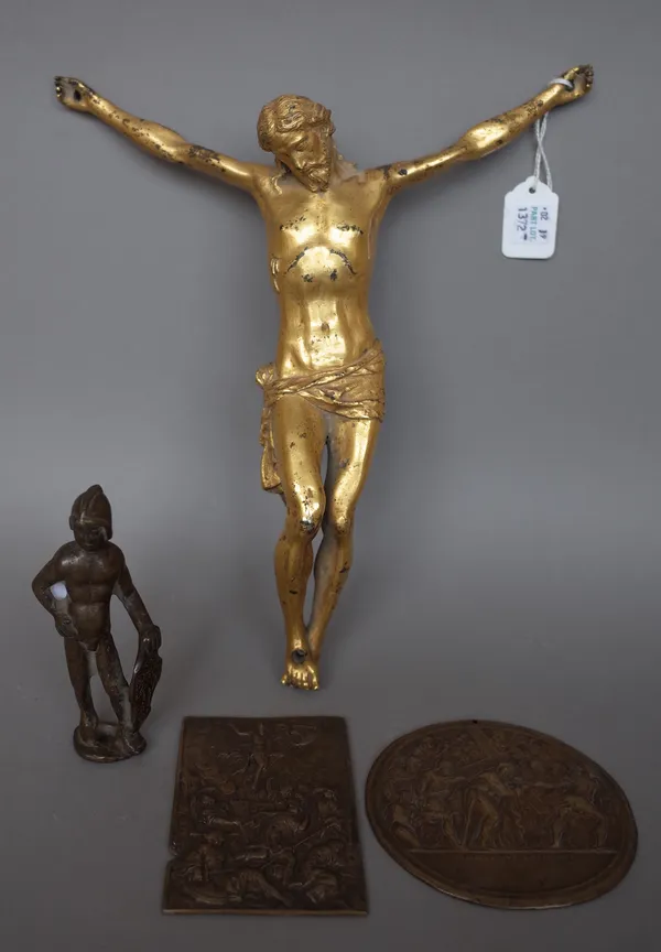 A gilt bronze figure of Jesus Christ, 29cm high, a bronze figure of a Romanesque warrior, 11cm high and two bronze plaques each relief cast with mytho