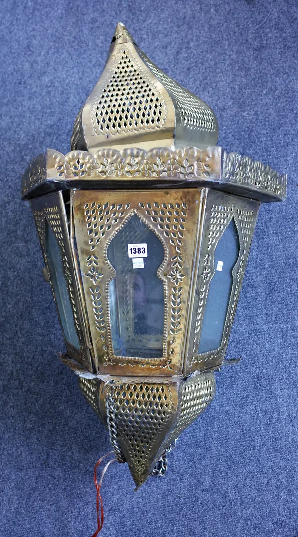 A modern Moroccan style sheet metal lantern of hexagonal tapering form with internal twin light fitments, 100cm high.