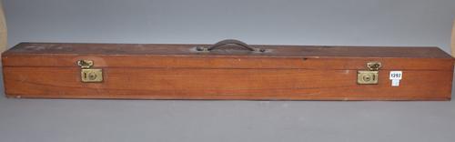 An early 20th century drop down projector screen housed in a wooden carry case, 117cm wide.