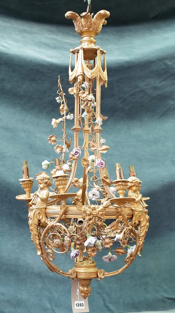 A modern gilt bronze six branch chandelier of classical Renaissance style, cast with cherub figures, bows and swags and profusely decorated with porce