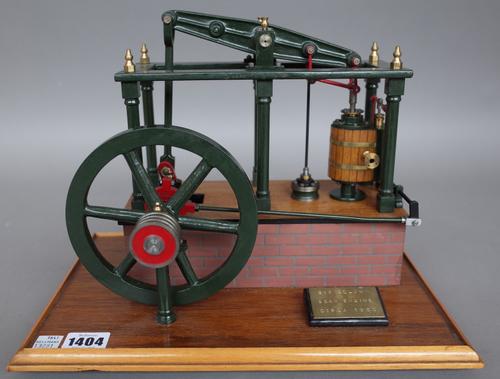 A model of a six column beam engine, modern mounted on a mahogany rectangular base, brass plaque titled 'Six column Beam Engine Circa 1850', 32.5cm wi