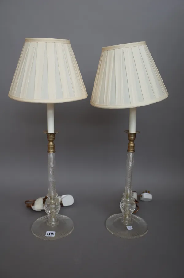 A pair of modern glass candlestick table lamps, each with cream pleated shades, 65cm high. (2)