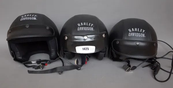 Five vinatge leather clad Harley Davidson motorcycle helmets, (5).