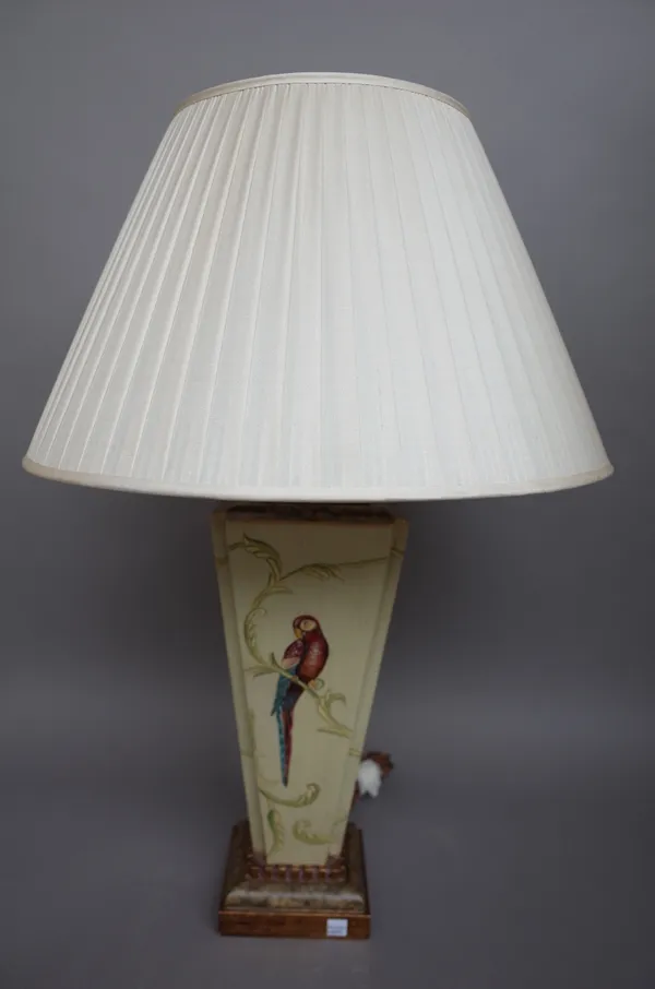 A modern composite table lamp of square tapering form detailed with a parrot against a foliate green ground, with cream pleated shades, 73cm high over