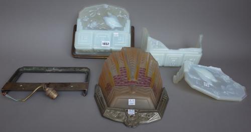 A pair of Art Deco opaline glass wall lights by 'Roberts' each relief moulded with wild birds amongst branches and held in a metal wall bracket, 26cm